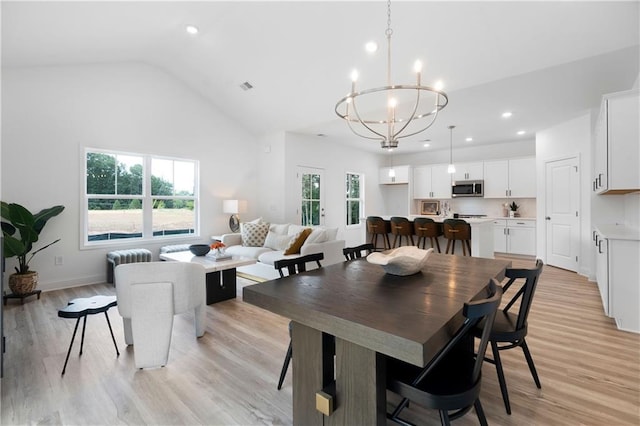 dining area featuring visible vents, baseboards, an inviting chandelier, recessed lighting, and light wood-style floors