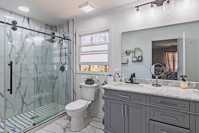 bathroom featuring a marble finish shower, marble finish floor, vanity, and toilet