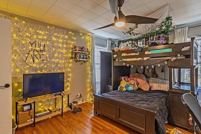 bedroom featuring wood finished floors