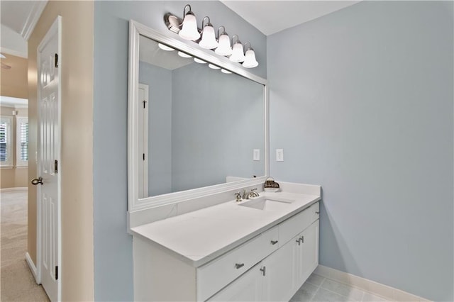 bathroom with baseboards and vanity