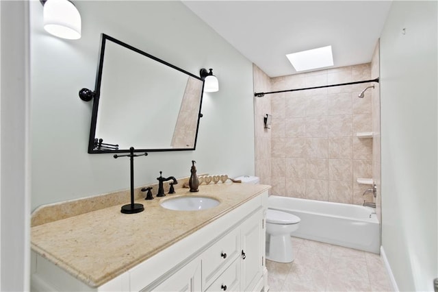 full bathroom featuring a skylight, vanity, tile patterned floors, toilet, and  shower combination