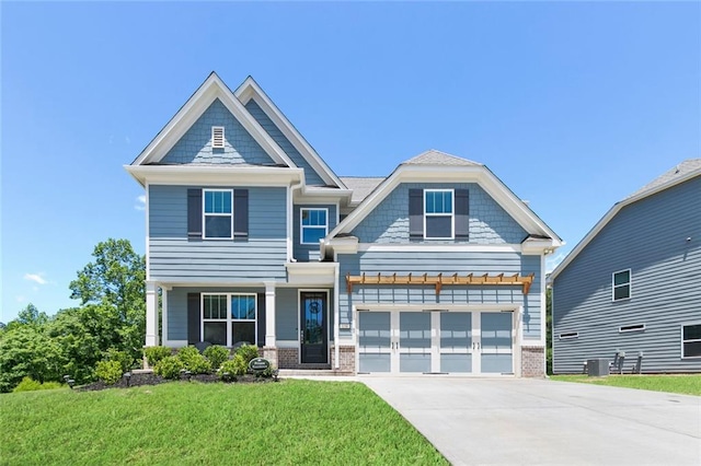 138 Daffodil Lndg, Dallas, GA 30132 - craftsman inspired home with concrete driveway, a front yard, brick siding, a garage, and central AC unit
