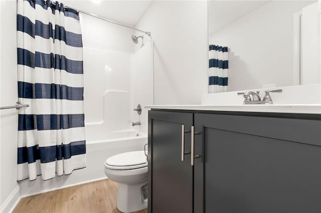 138 Daffodil Lndg, Dallas, GA 30132 - full bathroom with toilet, wood finished floors, vanity, and shower / bath combo with shower curtain