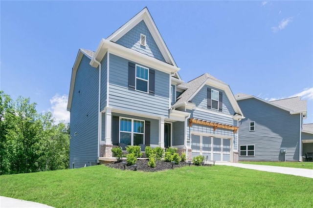 138 Daffodil Lndg, Dallas, GA 30132 - craftsman inspired home featuring a front lawn, driveway, covered porch, and a garage