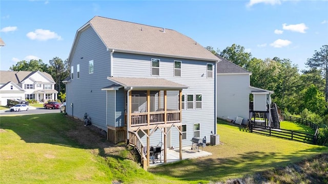138 Daffodil Lndg, Dallas, GA 30132 - back of property featuring stairs, a patio, a sunroom, a shingled roof, and central AC unit