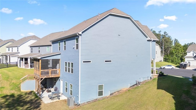 138 Daffodil Lndg, Dallas, GA 30132 - back of house with a sunroom, a yard, a patio, and central air condition unit