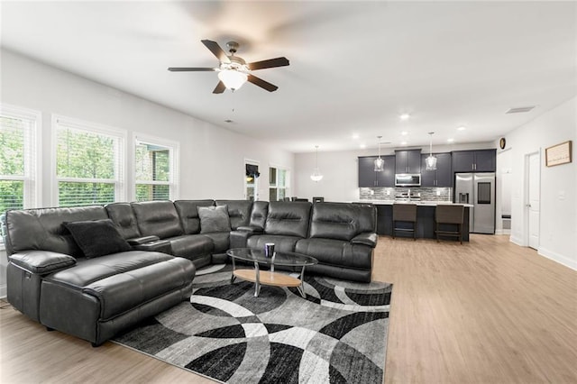 138 Daffodil Lndg, Dallas, GA 30132 - living area with light wood finished floors, a ceiling fan, recessed lighting, and baseboards