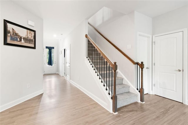 138 Daffodil Lndg, Dallas, GA 30132 - foyer entrance with light wood-style flooring, stairs, and baseboards