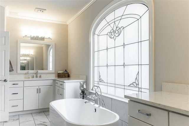 bathroom with vanity, a tub to relax in, and ornamental molding