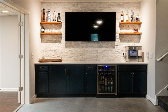 bar with wine cooler, backsplash, and concrete floors