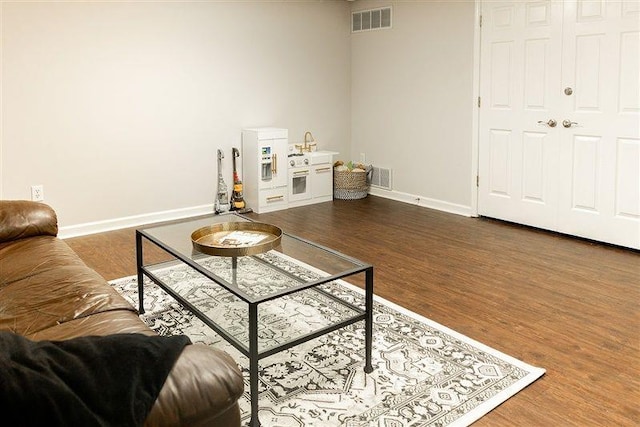 living room featuring dark hardwood / wood-style flooring