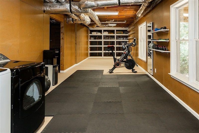 workout area with separate washer and dryer