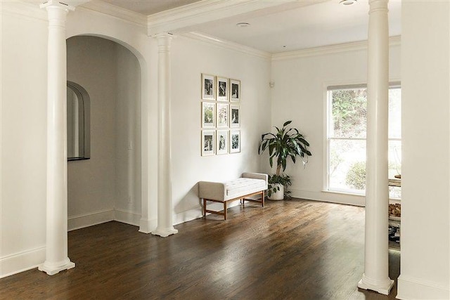 sitting room with ornate columns, ornamental molding, and dark hardwood / wood-style floors