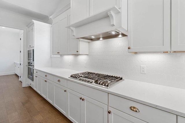 3610 Burnt Bridge Rd, Cumming, GA 30028 - kitchen with custom exhaust hood, appliances with stainless steel finishes, light countertops, white cabinets, and tasteful backsplash