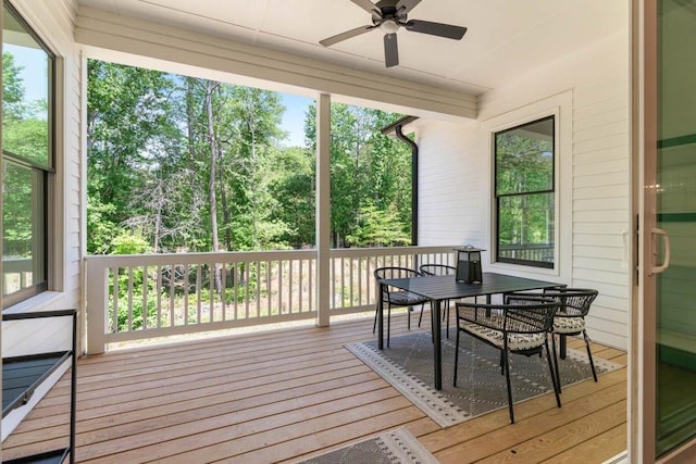3610 Burnt Bridge Rd, Cumming, GA 30028 - wooden terrace with ceiling fan, outdoor dining area, and view of wooded area