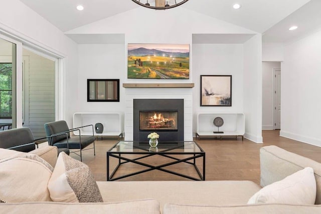 3610 Burnt Bridge Rd, Cumming, GA 30028 - living room with vaulted ceiling, wood finished floors, baseboards, recessed lighting, and a fireplace with flush hearth