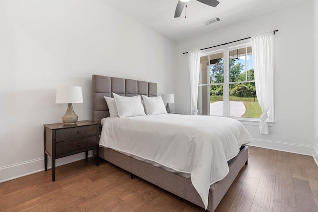 3610 Burnt Bridge Rd, Cumming, GA 30028 - bedroom with baseboards, wood finished floors, and ceiling fan