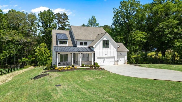 3610 Burnt Bridge Rd, Cumming, GA 30028 - modern inspired farmhouse with board and batten siding, a porch, concrete driveway, metal roof, and a standing seam roof