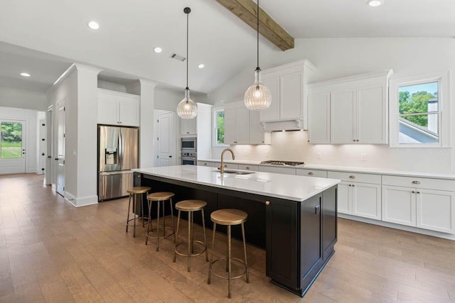 3610 Burnt Bridge Rd, Cumming, GA 30028 - kitchen featuring stainless steel appliances, a sink, white cabinets, a center island with sink, and recessed lighting