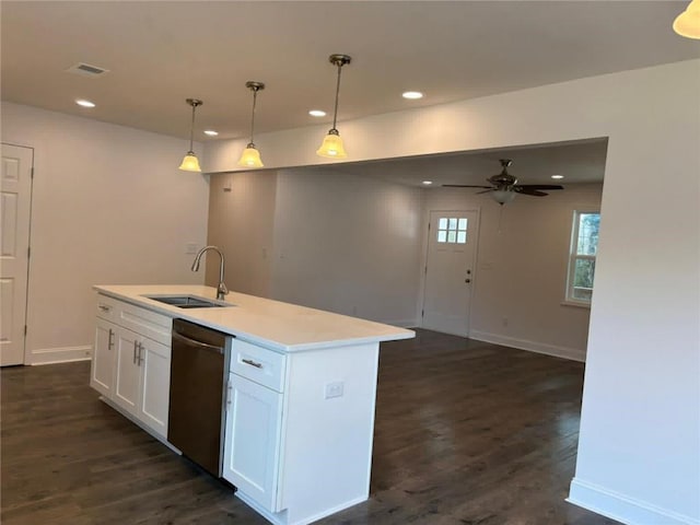 kitchen with sink, hanging light fixtures, stainless steel dishwasher, a kitchen island with sink, and white cabinets