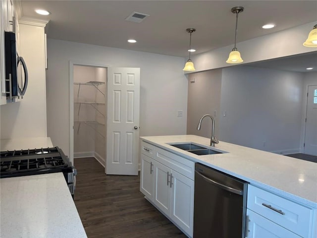 kitchen with pendant lighting, dishwasher, sink, white cabinets, and gas stove