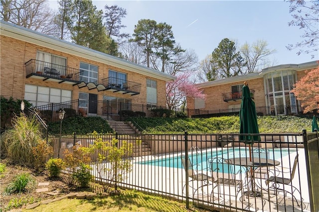 view of pool featuring a fenced in pool and fence