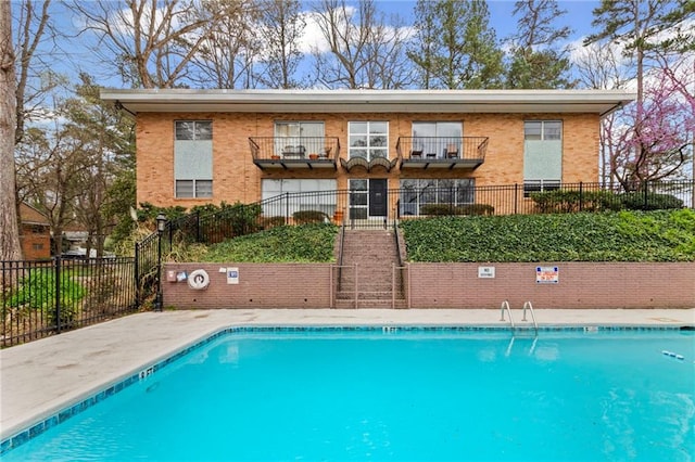 pool featuring fence