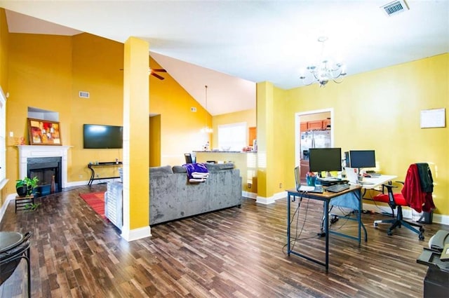 home office featuring hardwood / wood-style flooring, high vaulted ceiling, and an inviting chandelier