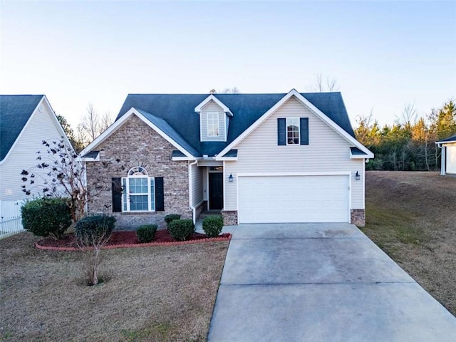 view of front facade with a front yard and a garage