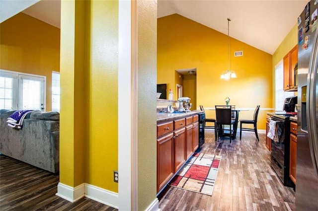 kitchen with dark hardwood / wood-style flooring, pendant lighting, an inviting chandelier, stainless steel fridge with ice dispenser, and black electric range oven