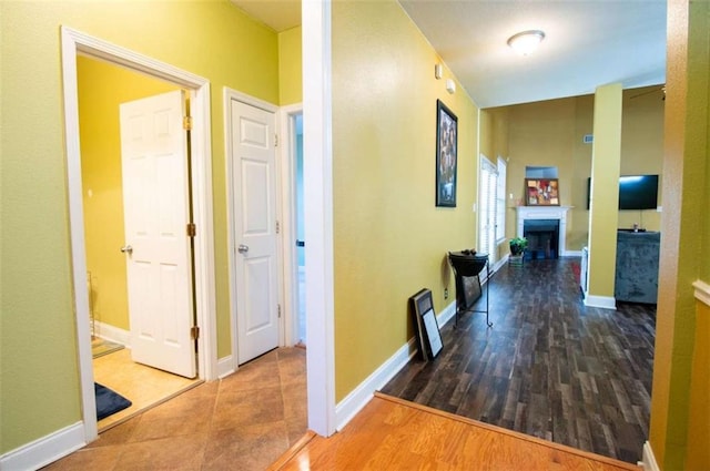 corridor featuring hardwood / wood-style floors