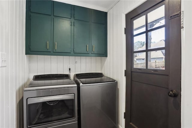 laundry room featuring cabinets and independent washer and dryer