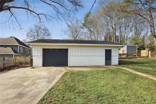 garage featuring a lawn