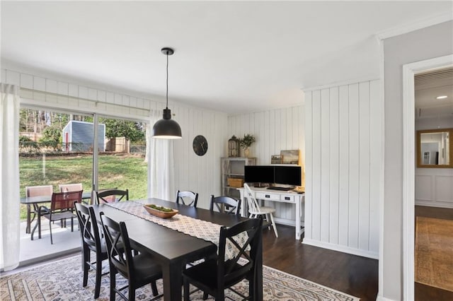 dining area featuring dark wood-type flooring