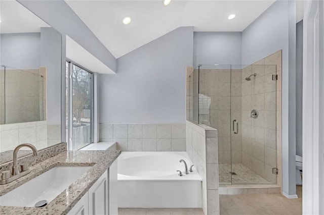 full bathroom featuring tile patterned flooring, vanity, plus walk in shower, and toilet