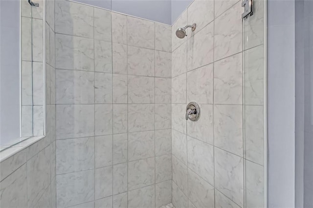 bathroom with tiled shower