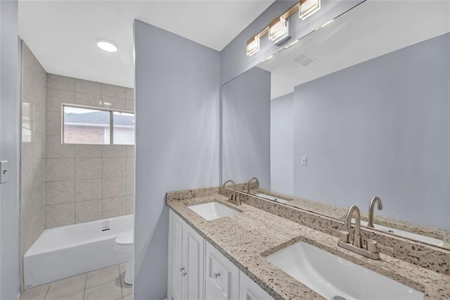 bathroom with tile patterned floors, vanity, and toilet