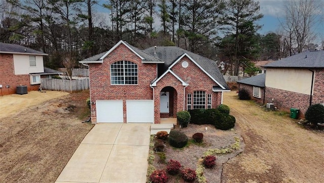 view of front of property with a garage, cooling unit, and a front lawn