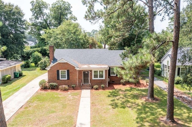 ranch-style home featuring a front yard