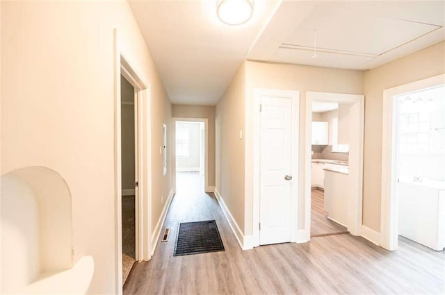 corridor featuring light hardwood / wood-style flooring