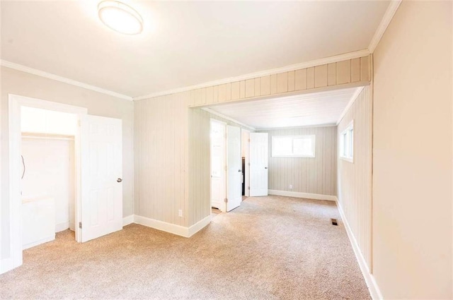 spare room with light colored carpet and ornamental molding