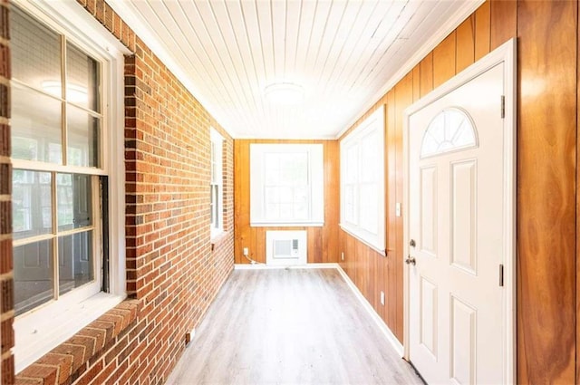 unfurnished sunroom featuring wooden ceiling and a healthy amount of sunlight