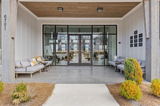 doorway to property featuring a patio, french doors, and outdoor lounge area