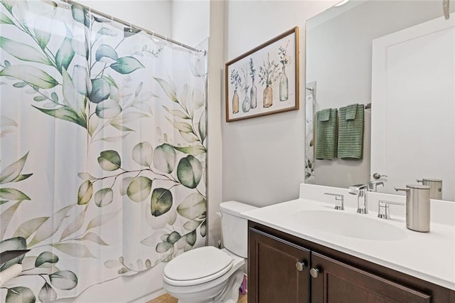 full bath with toilet, shower / bath combo, and vanity