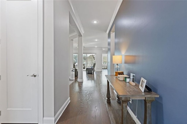 hallway with recessed lighting, wood finished floors, and baseboards