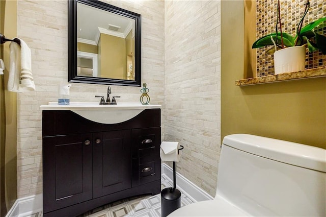 bathroom with visible vents, crown molding, vanity, and toilet