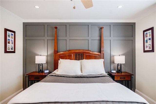 bedroom with a decorative wall, crown molding, and recessed lighting