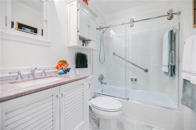 bathroom with toilet, shower / bath combination with glass door, ornamental molding, and vanity