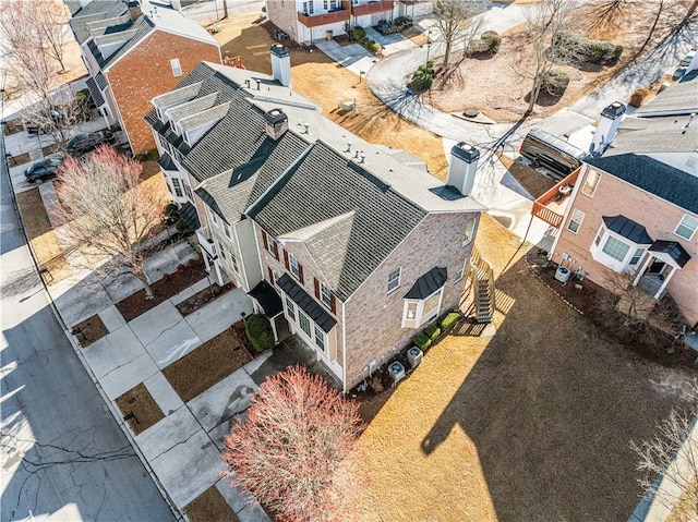 birds eye view of property with a residential view