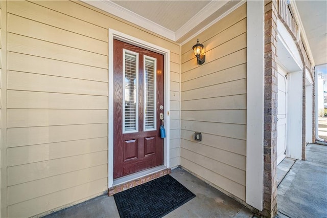 doorway to property featuring covered porch